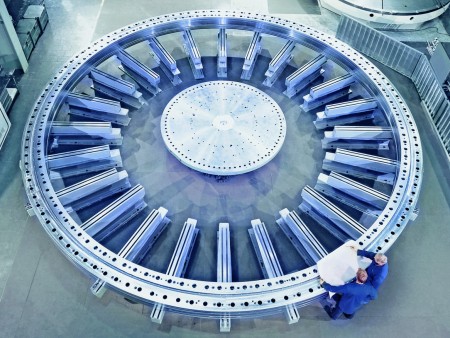 Slewing bearing with two men in factory clothing