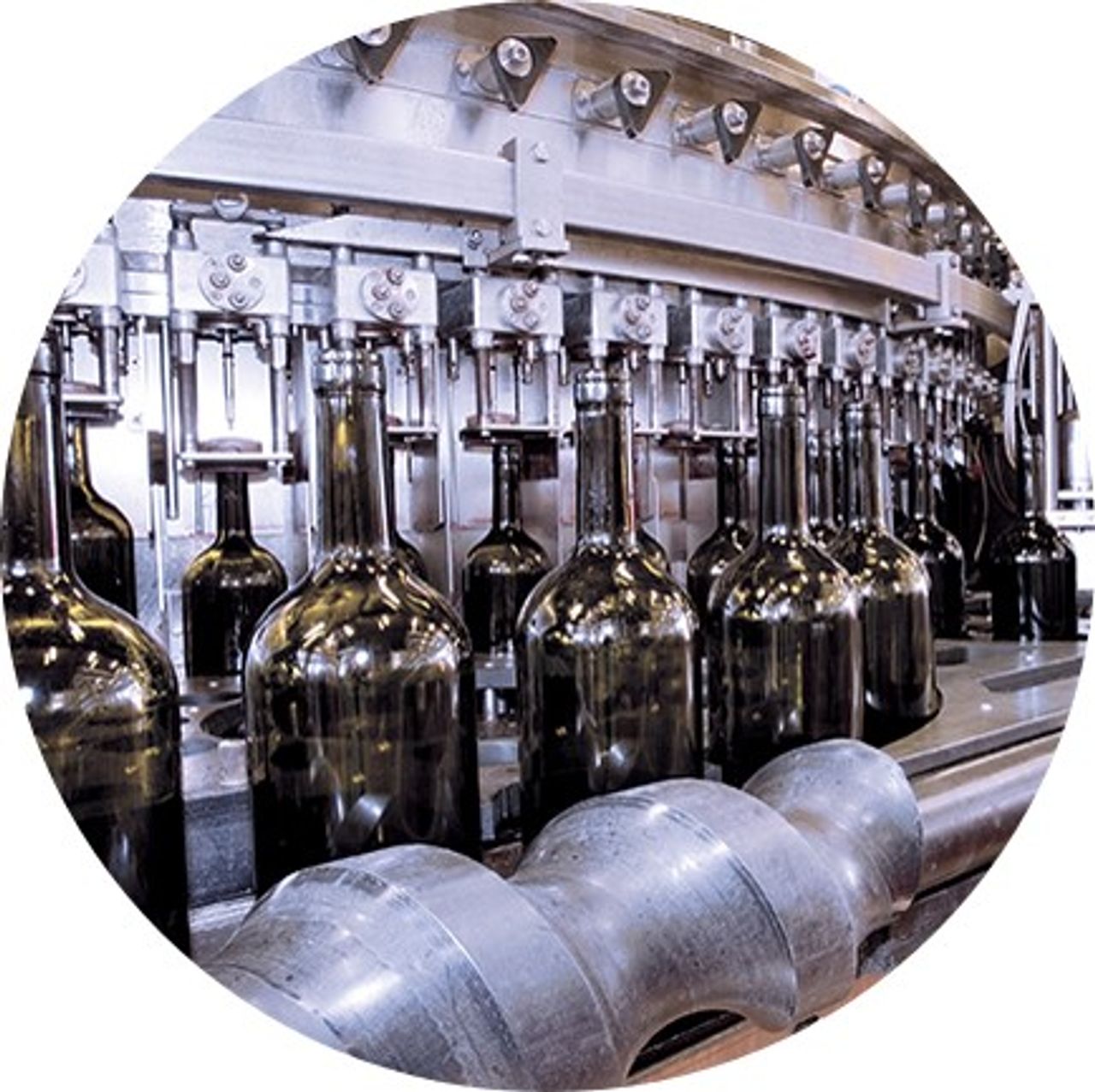 Glass bottles are filled with a filling machine